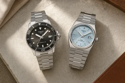Tissot Seastar 1000 e Tissot PRX lado a lado sobre pedra clara